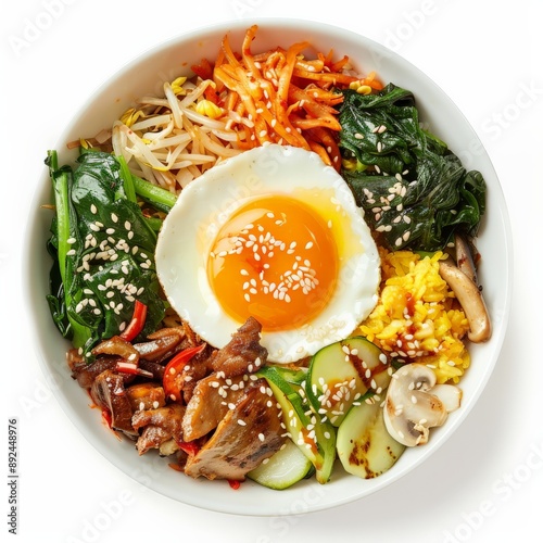 A close-up shot of a vegetarian bibimbap bowl with a fried egg on top