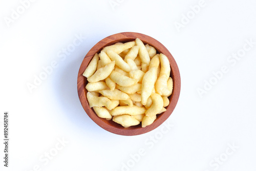 Crunchy Cheese Stick or Cheese Cork Eggs or Telur Gabus Keju or Widaran or Bidaran Keju on small wooden bowl isolated on white background