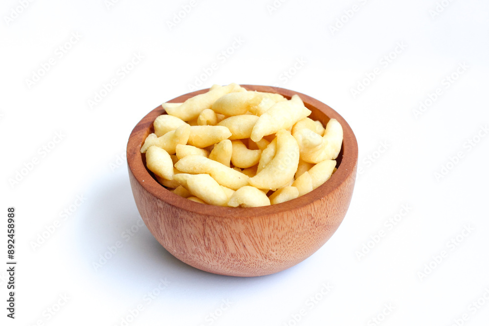 Crunchy Cheese Stick or Cheese Cork Eggs or Telur Gabus Keju or Widaran or Bidaran Keju on small wooden bowl isolated on white background Crunchy Cheese Stick or Cheese Cork Eggs or Telur Gabus Keju or Widaran or Bidaran Keju on small wooden bowl isolated on white background