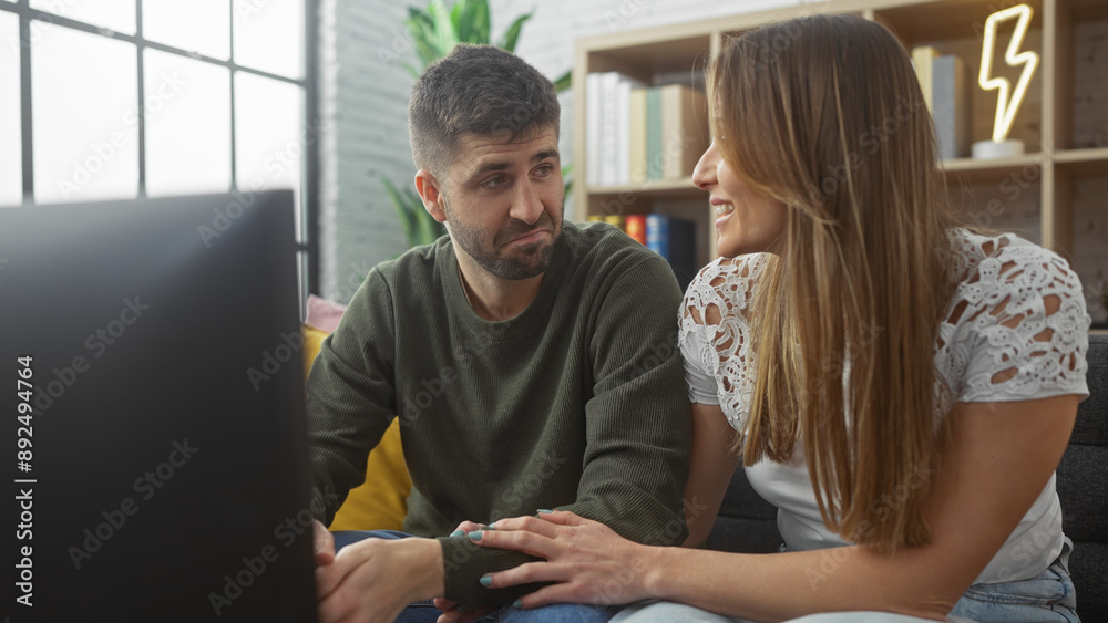 A loving couple enjoys quality time together in a cozy living room, reflecting a scene of domestic life and companionship. A loving couple enjoys quality time together in a cozy living room, reflecting a scene of domestic life and companionship.