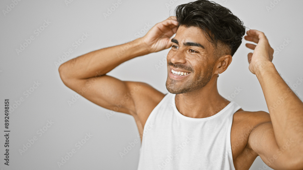 Handsome young hispanic man with beard smiling against isolated white background. Handsome young hispanic man with beard smiling against isolated white background.