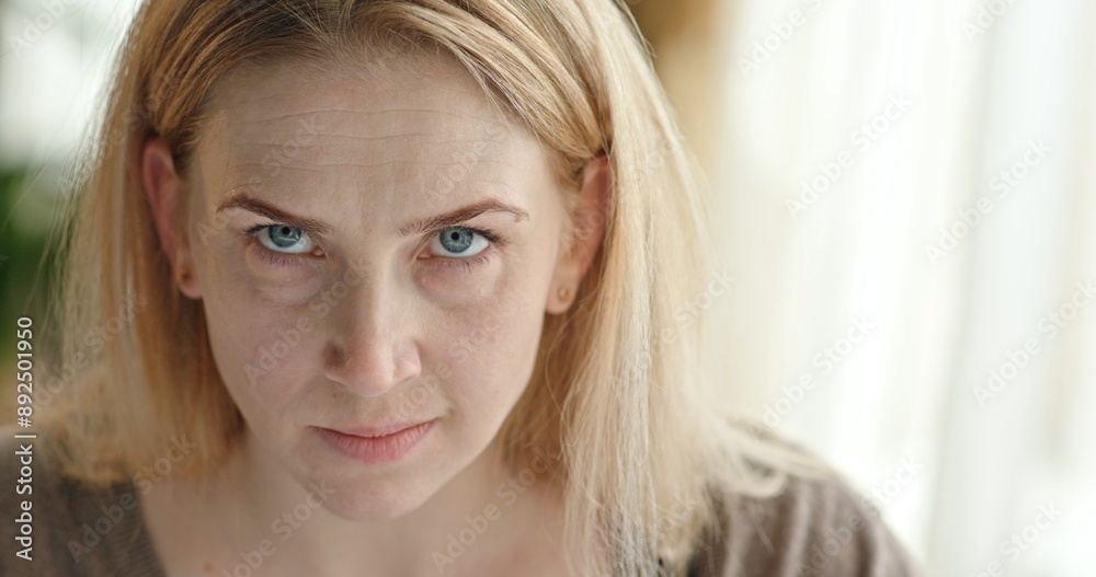 The cruel and nervous look of an evil woman and evil words in the camera The cruel and nervous look of an evil woman and evil words in the camera