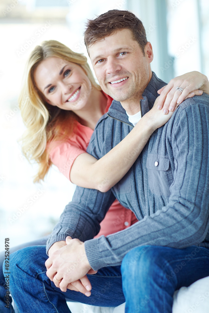 Portrait, hug and happy couple on sofa for love, relax and loyalty together in lounge. Smile, man and woman embrace in home for support, connection and care for relationship commitment with partner Portrait, hug and happy couple on sofa for love, relax and loyalty together in lounge. Smile, man and woman embrace in home for support, connection and care for relationship commitment with partner