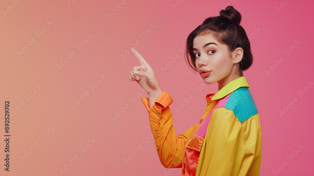 Portrait of a beautiful woman pointing her fingers isolated on a pastel background. Portrait of a beautiful woman pointing her fingers isolated on a pastel background.