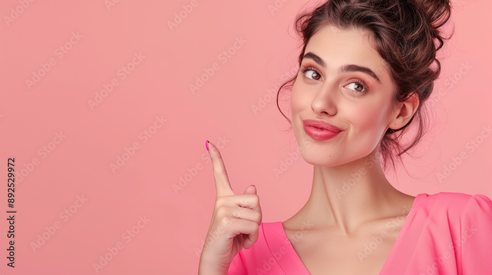 Portrait of a beautiful woman pointing her fingers isolated on a pastel background. Portrait of a beautiful woman pointing her fingers isolated on a pastel background.