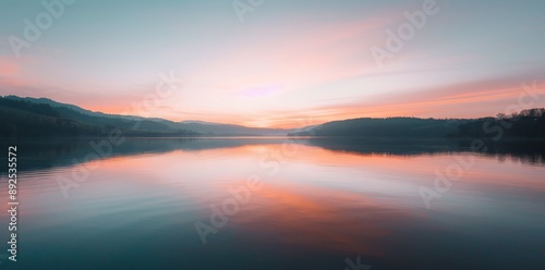 Serene Lake Reflecting the Hues of a Stunning Sunset.