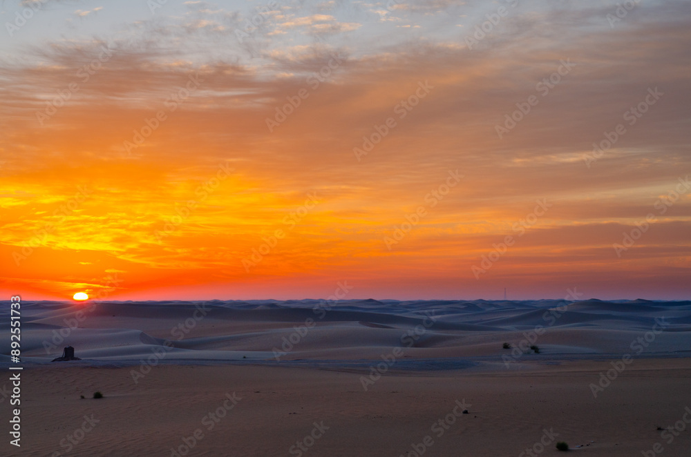 sunset sunrise with beautiful cloud color in the desert sand dune. sunset sunrise with beautiful cloud color in the desert sand dune.