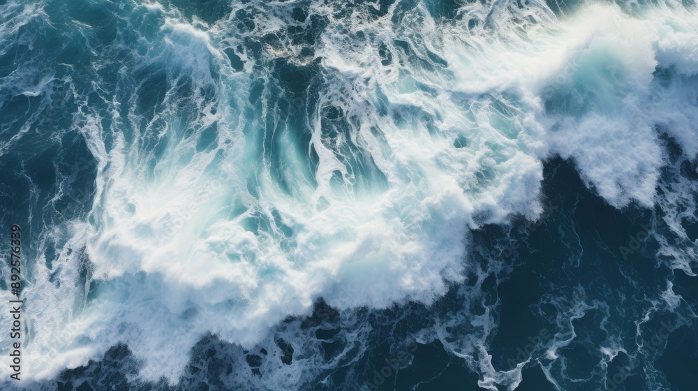 Top-down view of waves smashing against coastal rocks, dramatic ocean scene Top-down view of waves smashing against coastal rocks, dramatic ocean scene