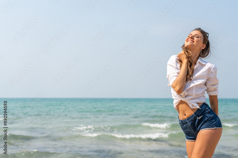 Portrait of smiling fashion woman relaxation on the tropical beach.Happy young beautiful girl enjoying and having fun on the tropical island.Summer vacation and travel. Portrait of smiling fashion woman relaxation on the tropical beach.Happy young beautiful girl enjoying and having fun on the tropical island.Summer vacation and travel.