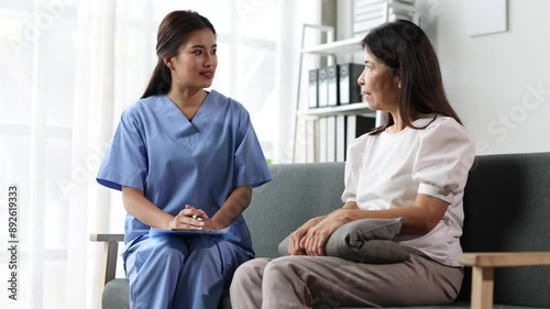 Wallpaper Mural Home health care consultation by nurse with patient at home. Nurse provides a warm and attentive home health care consultation with a patient on a sofa. Torontodigital.ca
