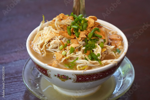 a bowl of soto kudus, a traditional Indonesian vegetable and noodle soup.