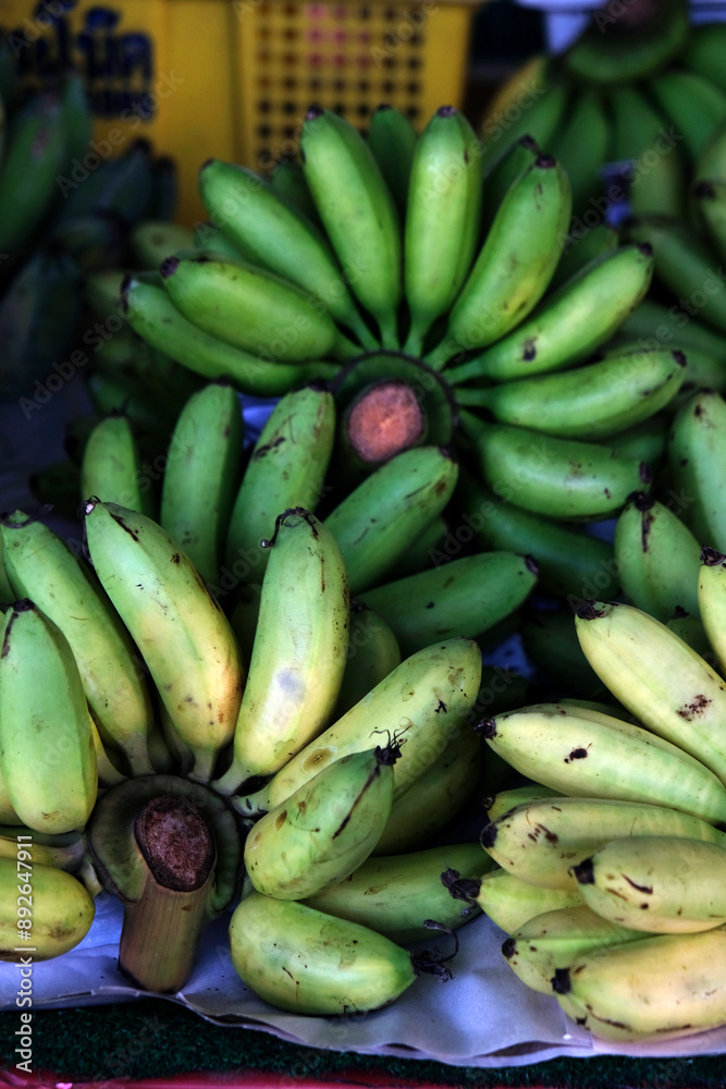 green bananas at the market