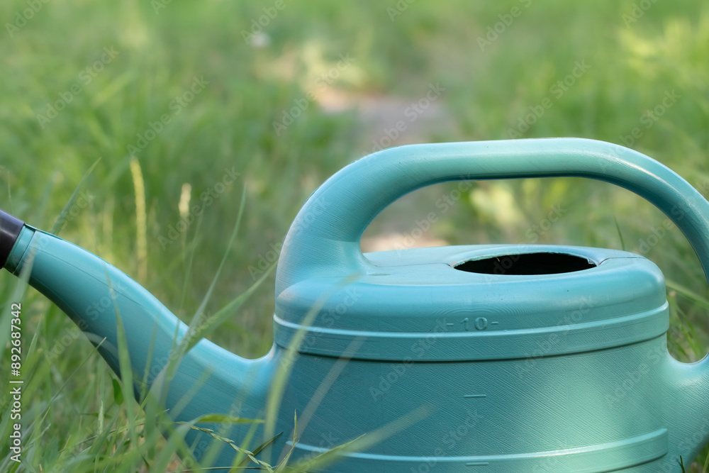 Plastic garden watering can.Holiday and hobby concept. Plastic garden watering can.Holiday and hobby concept.