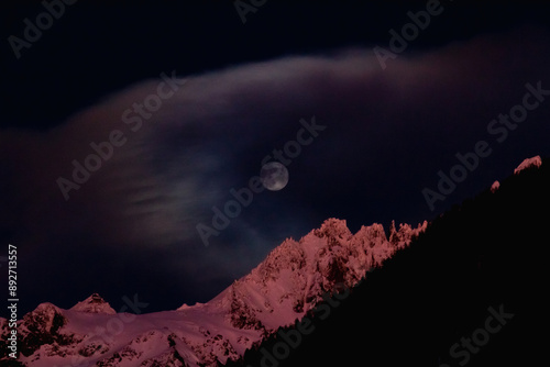 full moon in alps on the sunset photo