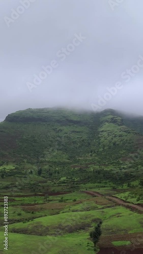 Beautiful aerial view of mountains and green fields in monsoon. photo