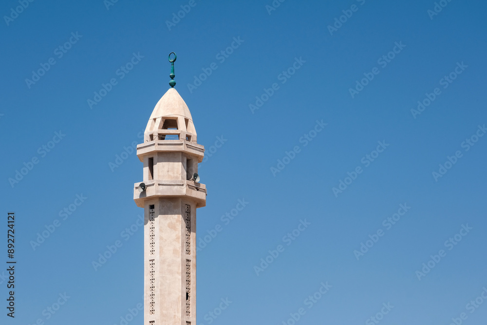Minaret of the mosque on the background of blue sky. Dahab, Egypt. Minaret of the mosque on the background of blue sky. Dahab, Egypt.