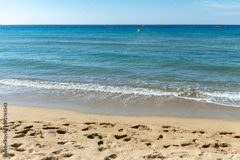 Morning view on crystal clear blue water of Plage du Debarquement white sandy beach near Cavalaire-sur-Mer and La Croix-Valmer, summer vacation on French Riviera, Var, France Morning view on crystal clear blue water of Plage du Debarquement white sandy beach near Cavalaire-sur-Mer and La Croix-Valmer, summer vacation on French Riviera, Var, France
