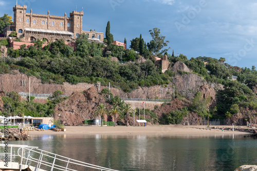 Coastline with stones, bays, castle in Mandelieu-la-napoule near Cannes, French Riviera, France photo