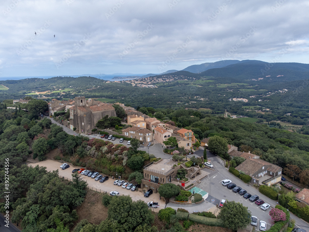 Fototapeta premium Landscape of French Riviera, view on hills, houses and green vineyards from above Cotes de Provence, production of rose wine near Saint-Tropez and Pampelonne beach, Var, France