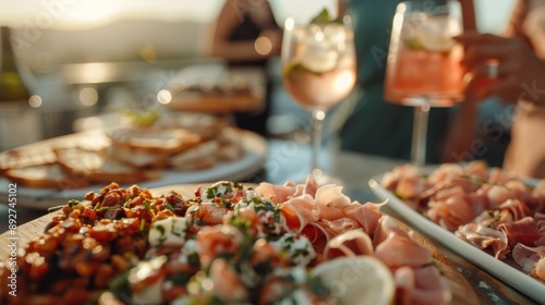 This image showcases a variety of delicious appetizers and cocktails being served on a table, highlighting a joyful social event with a delightful culinary experience. photo