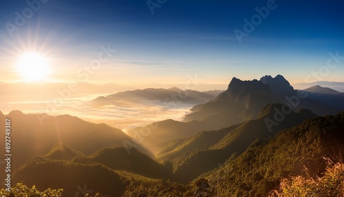 morning sunlight on chiangdao mountain captivating landscape of foggy valley in chiangmai thailand photo
