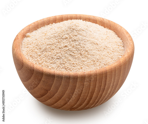 Manioc or cassava flour in wooden bowl on white background. File contains clipping path.