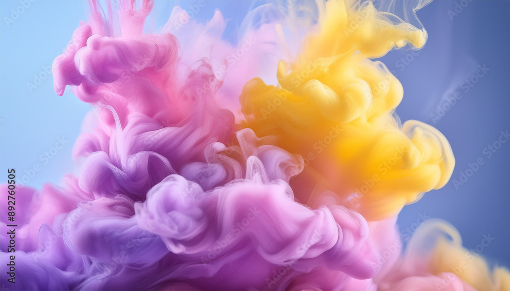 Fototapeta premium Swirling mix of pink, yellow and purple ink clouds on blue backdrop.