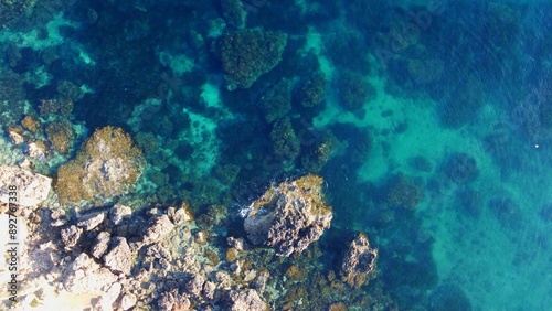 Rocky beach and sapphire sea water on the Maltese island, mediterranean sea, Ghajn Tuffieha bay , Malta. High quality photo