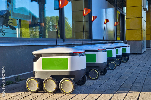 Delivery robots parking near the grocery store. Automated home delivery