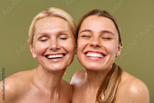 Young and mature women on an olive background