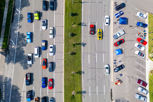 Aerial view of row of classic cars among regular cars at wood ward dream cruise in Detroit, Michigan. photo