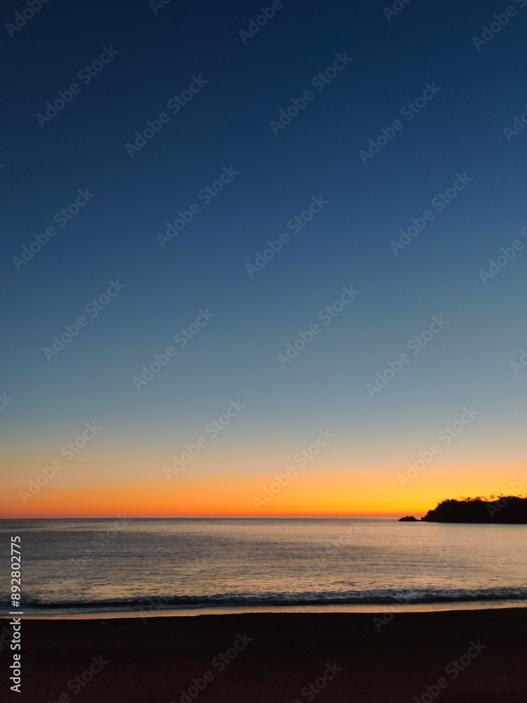 Fototapeta premium beautiful dramatic landscape of sunset on the sea beach