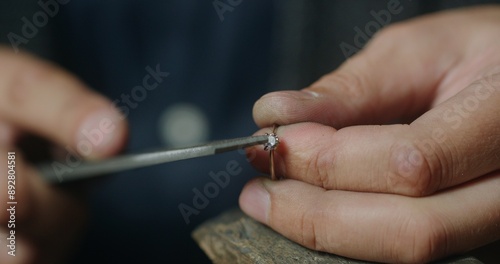 Принти на полотні Male jeweler shaping prong setting of gold ring