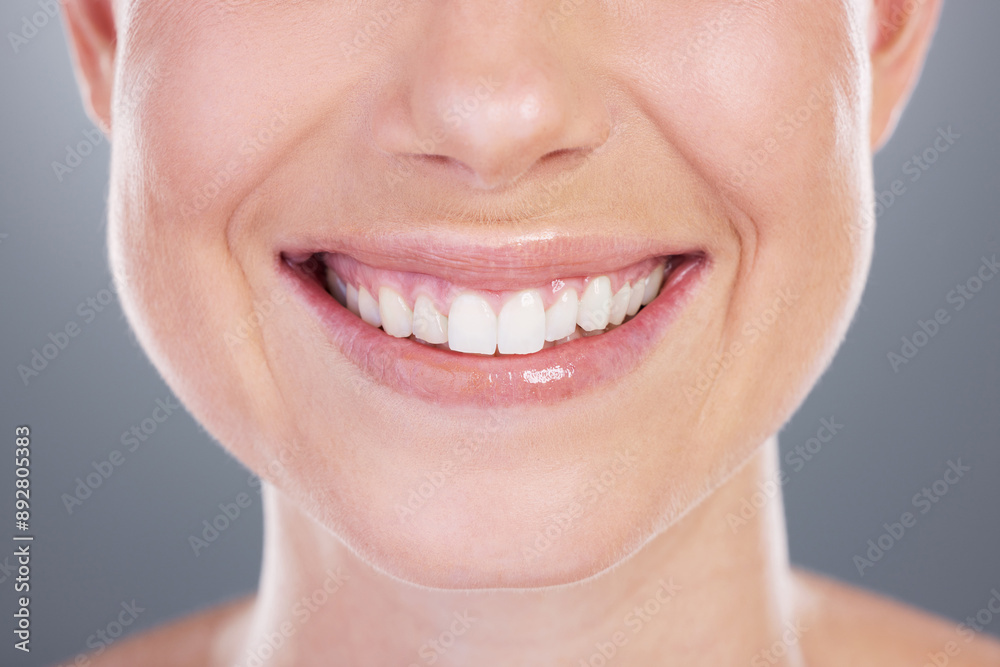 Woman, smile and oral care in studio for wellness, cosmetics and proud on gray background. Female person, dental health and satisfaction for mouth hygiene, confidence and orthodontics healthcare Woman, smile and oral care in studio for wellness, cosmetics and proud on gray background. Female person, dental health and satisfaction for mouth hygiene, confidence and orthodontics healthcare