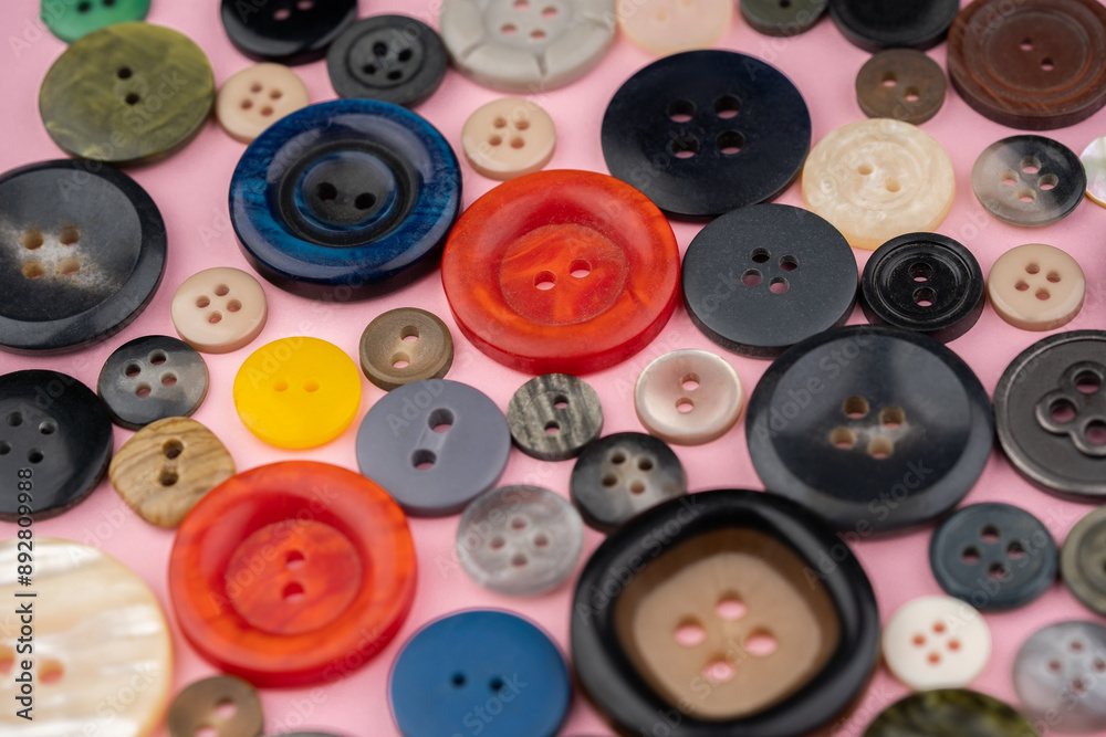 Many different buttons on a pink background Many different buttons on a pink background