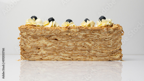 Section of a cake on a white background, cake layers, cream, pastries, dessert. photo