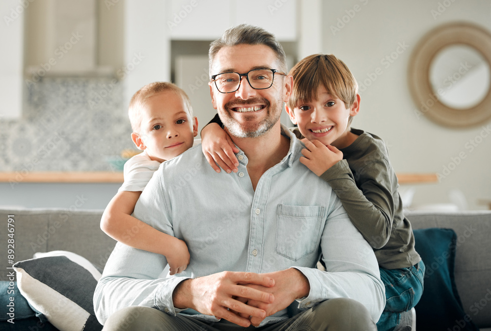 © peopleimages.com - Dad, kids and hug in home portrait, peace and single parent love for boys in living room. Father, children and embrace for security on couch for care in childhood, relationship and comfortable joy