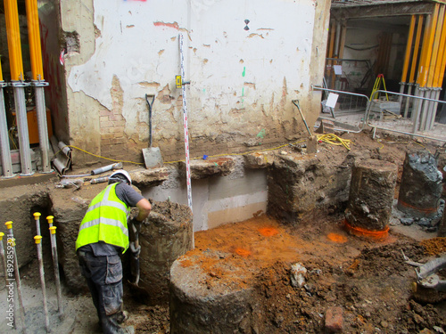 Underpinning process for strengthening and stabilizing the foundation of an existing building. Structural reinforcement and foundation stabilization.