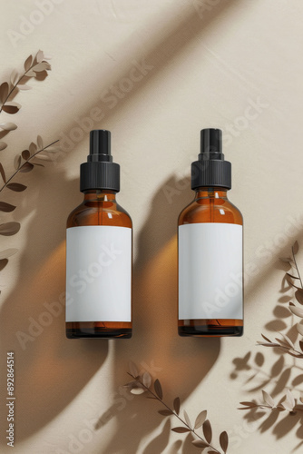 Two Amber Glass Spray Bottles With White Labels