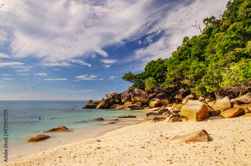 Picturesque tropical beach with boulders and turquoise water on Fitzroy Island. It is a continental island southeast of Cairns, Queensland, Australia. photo