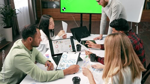 A team of young multinational business people are working on a startup. New generation of startups. communication network. Project discussion, smile, brainstorm, business idea generation. Green screen