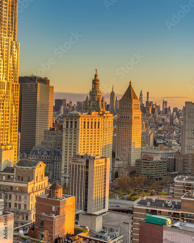New York City. Manhattan downtown skyline skyscrapers at sunset. Golden Hour.