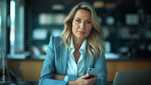 Free Download Middle age caucasian businesswoman using smartphone and laptop in office, copy space - GFXLoad