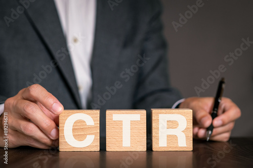 There is wood cube with the word CTR. It is an abbreviation for Click Through Rate as eye-catching image.