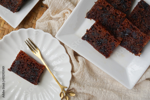 Kek Buah Kukus, a traditional Malaysian steamed fruit cake filled with dried fruits, nuts, and spices photo