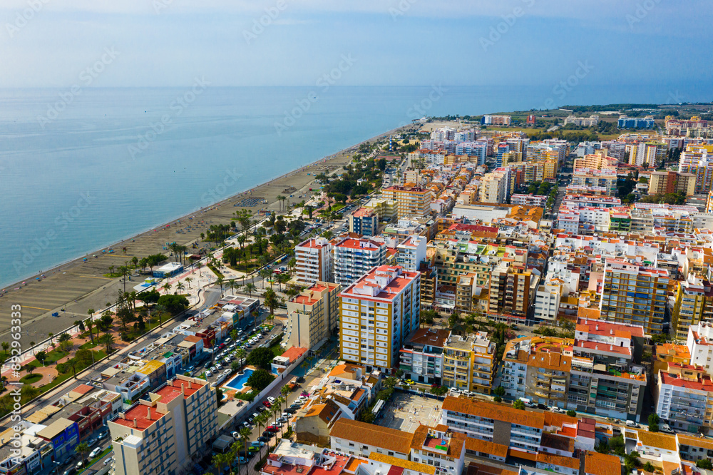 Fototapeta premium Scenic aerial view of Spanish tourist town of Torre del Mar on Mediterranean coast in sunny autumn day, province of Malaga..