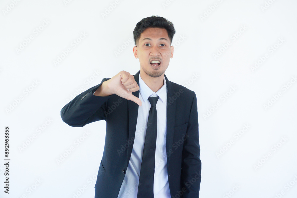Asian manager wearing black suit give bad evaluation sign during interview process Asian manager wearing black suit give bad evaluation sign during interview process