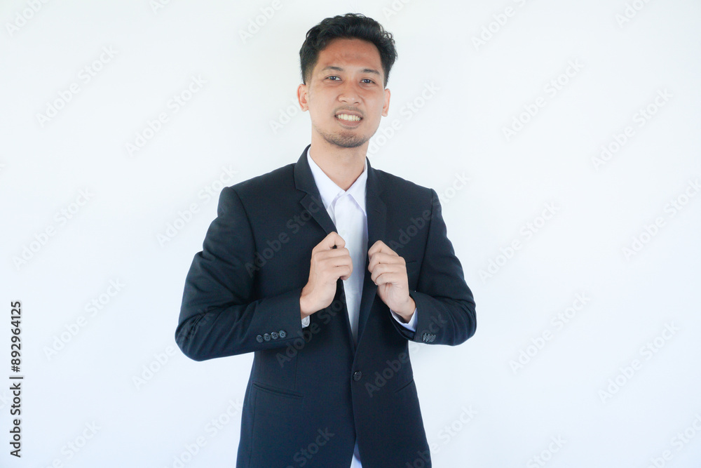 Asian businessman smiling confident at the camera Asian businessman smiling confident at the camera