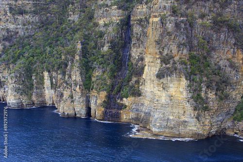 High angle view of sedimentary rocks and cliffs near the sea at Tasman Peninsula, Tasmania, Australia
 photo