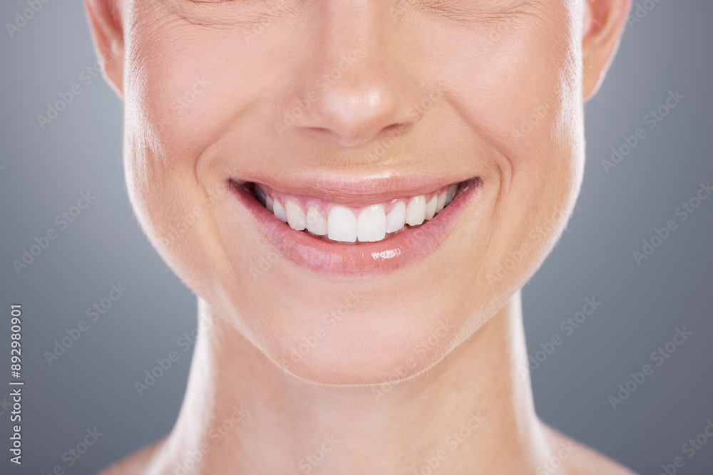 Woman, smile and teeth whitening results in studio, cosmetics and mouth on gray background. Female person, dental health and satisfaction for oral hygiene, confidence and orthodontics healthcare Woman, smile and teeth whitening results in studio, cosmetics and mouth on gray background. Female person, dental health and satisfaction for oral hygiene, confidence and orthodontics healthcare